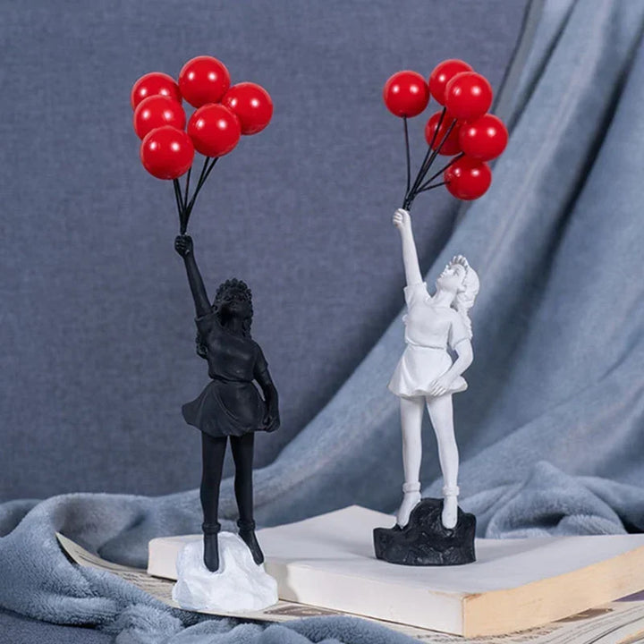 Skulptur av en flicka med ballong i Banksy-stil för bordsdekoration och kreativ inredning av vardagsrum