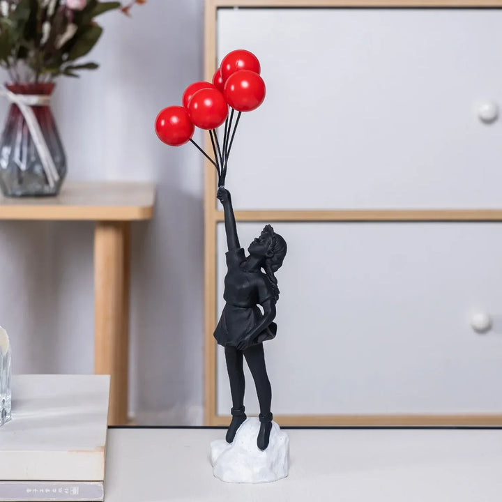Skulptur av en flicka med ballong i Banksy-stil för bordsdekoration och kreativ inredning av vardagsrum