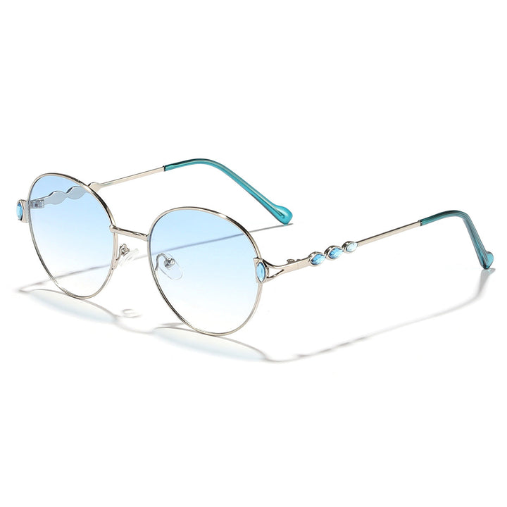 Kvinnors runda solglasögon med elegant metallram och spegelglas