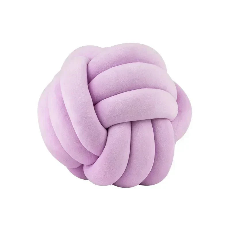 Dekorativ, mjuk kudde med knuten boll i mocka-look